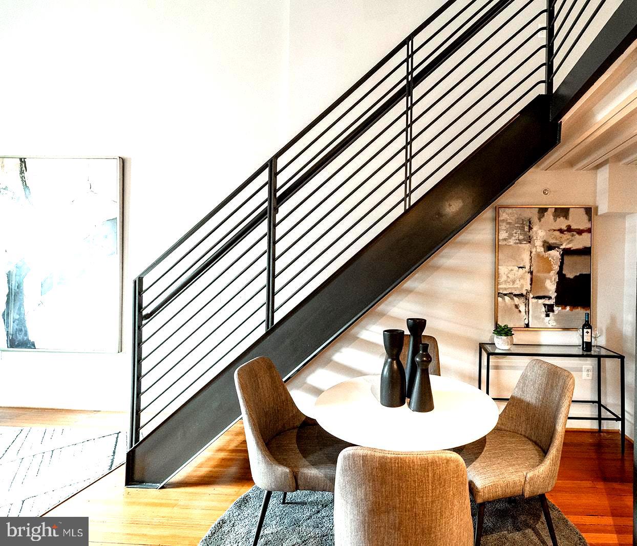 1401 R Street Northwest, Unit 406 Washington, DC 20009 - Photo 6 of 22 a kitchen with a table and chairs in it