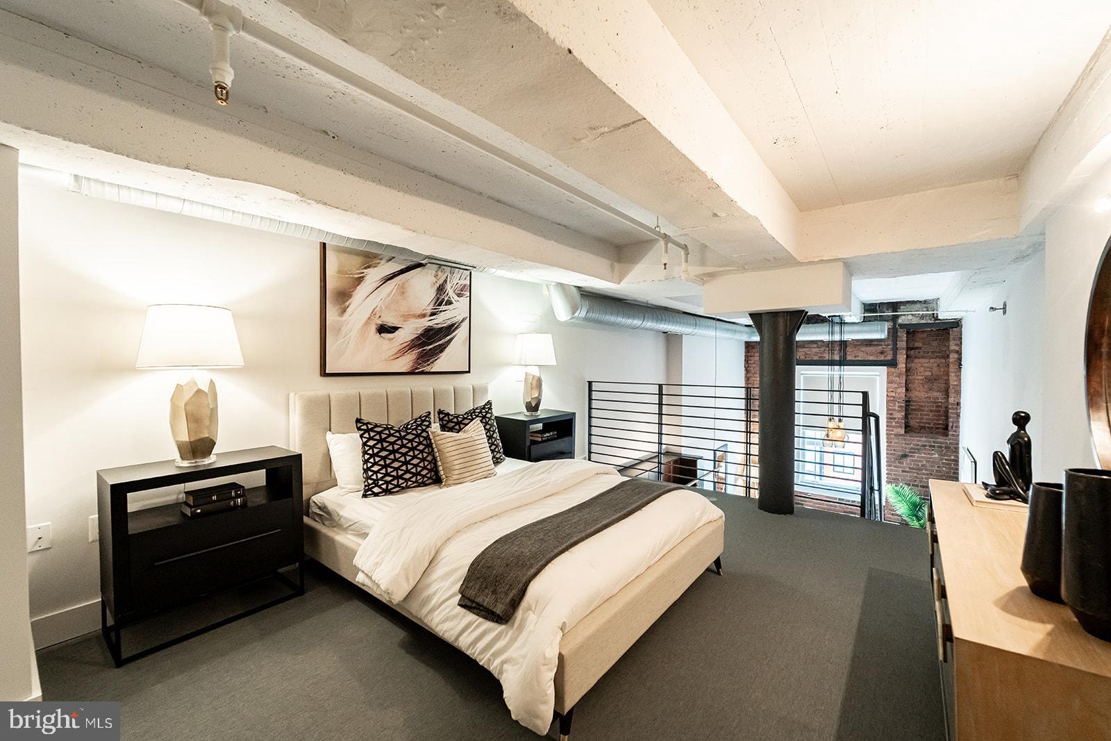 1401 R Street Northwest, Unit 406 Washington, DC 20009 - Photo 9 of 22 a bedroom with bed and a night stand