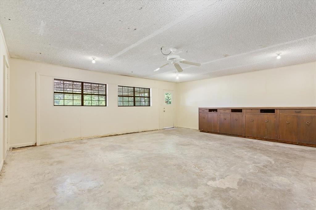 1487 Middleton Road Mart, TX 76664 - Photo 12 of 40 an empty room with windows and ceiling fan