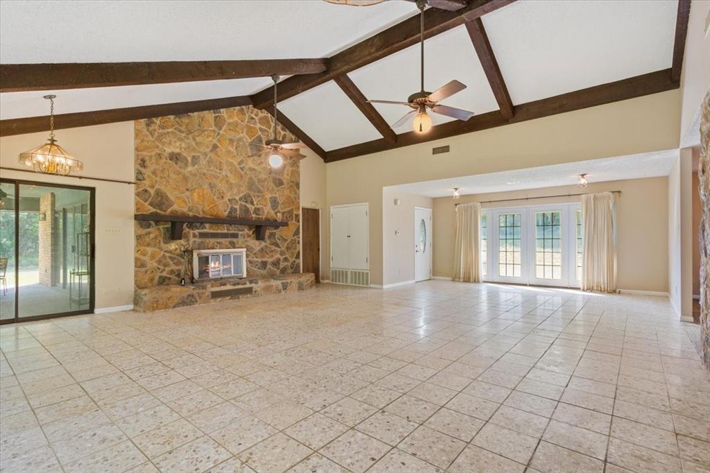 1487 Middleton Road Mart, TX 76664 - Photo 14 of 40 a view of an empty room with a window and fireplace