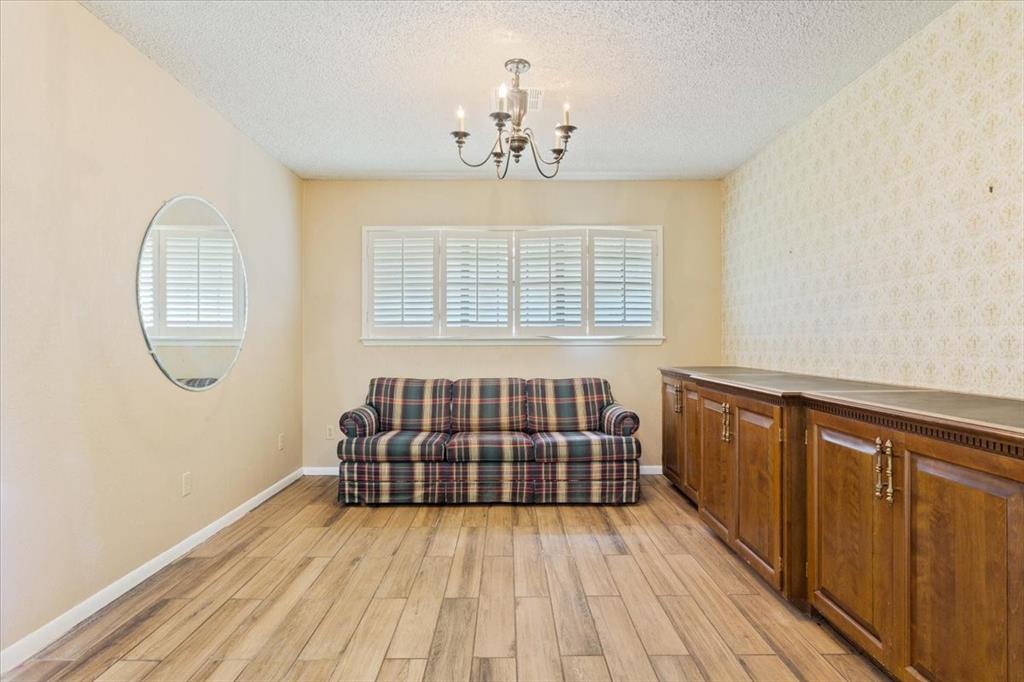 1487 Middleton Road Mart, TX 76664 - Photo 18 of 40 wooden floor in an empty room with a window