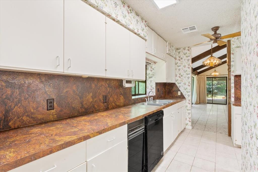 1487 Middleton Road Mart, TX 76664 - Photo 19 of 40 a kitchen with a sink and cabinets