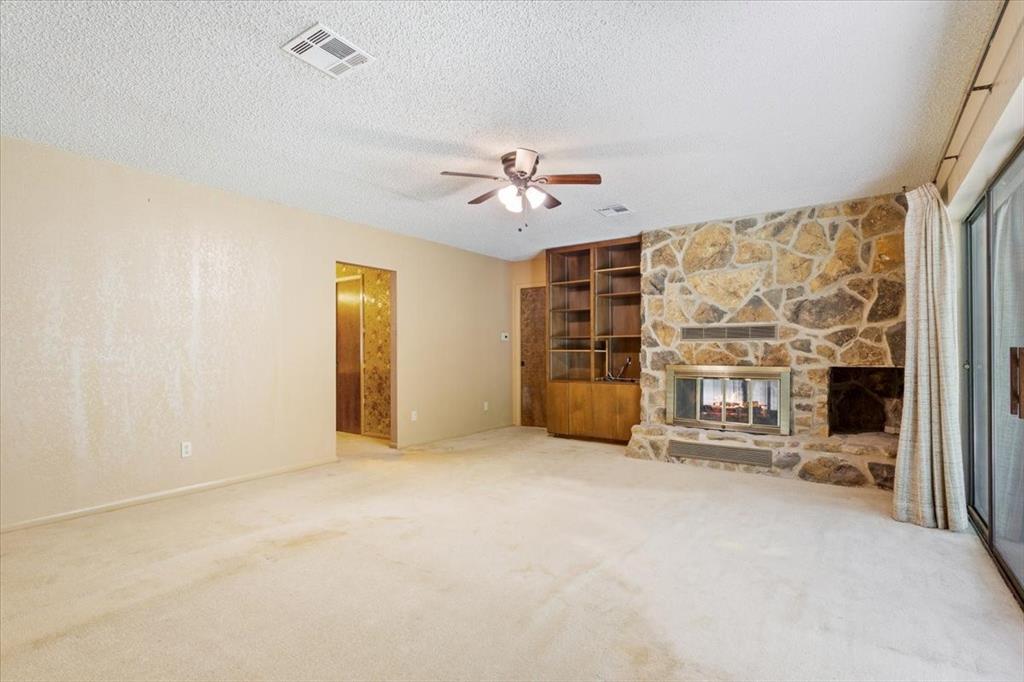 1487 Middleton Road Mart, TX 76664 - Photo 25 of 40 an empty room with windows and chandelier fan