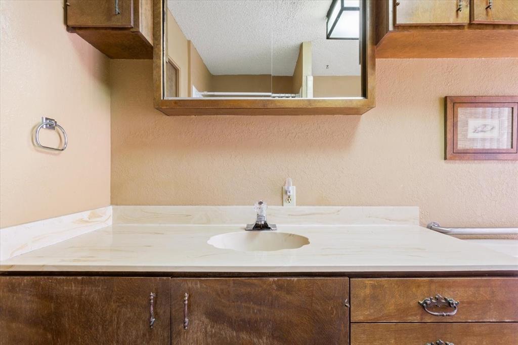 1487 Middleton Road Mart, TX 76664 - Photo 32 of 40 a bathroom with a sink and a mirror