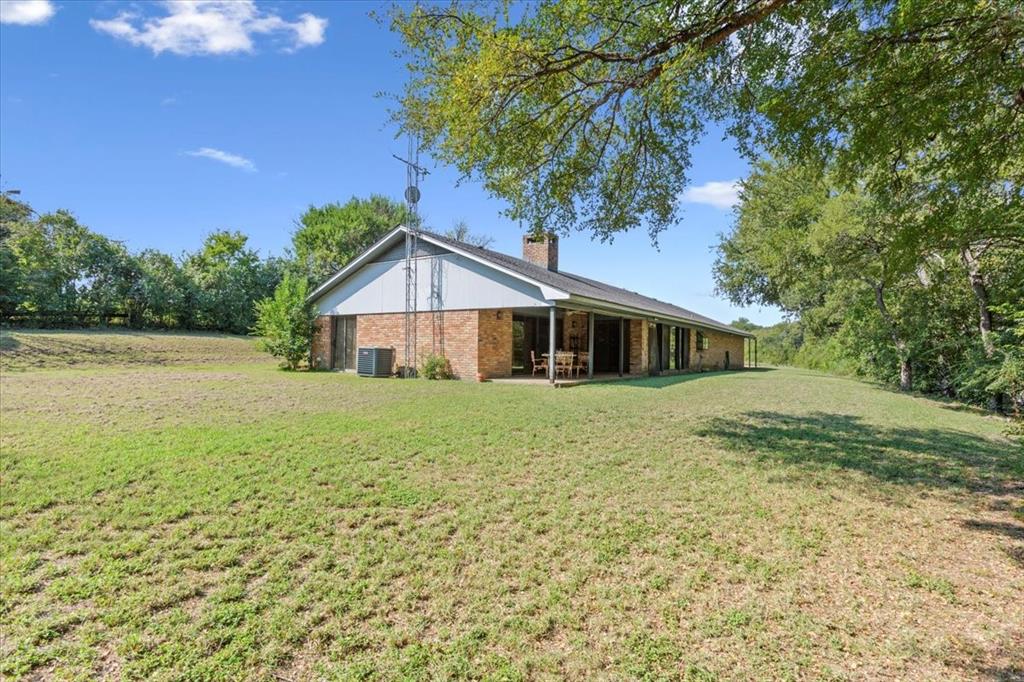 1487 Middleton Road Mart, TX 76664 - Photo 7 of 40 a front view of house with yard and green space