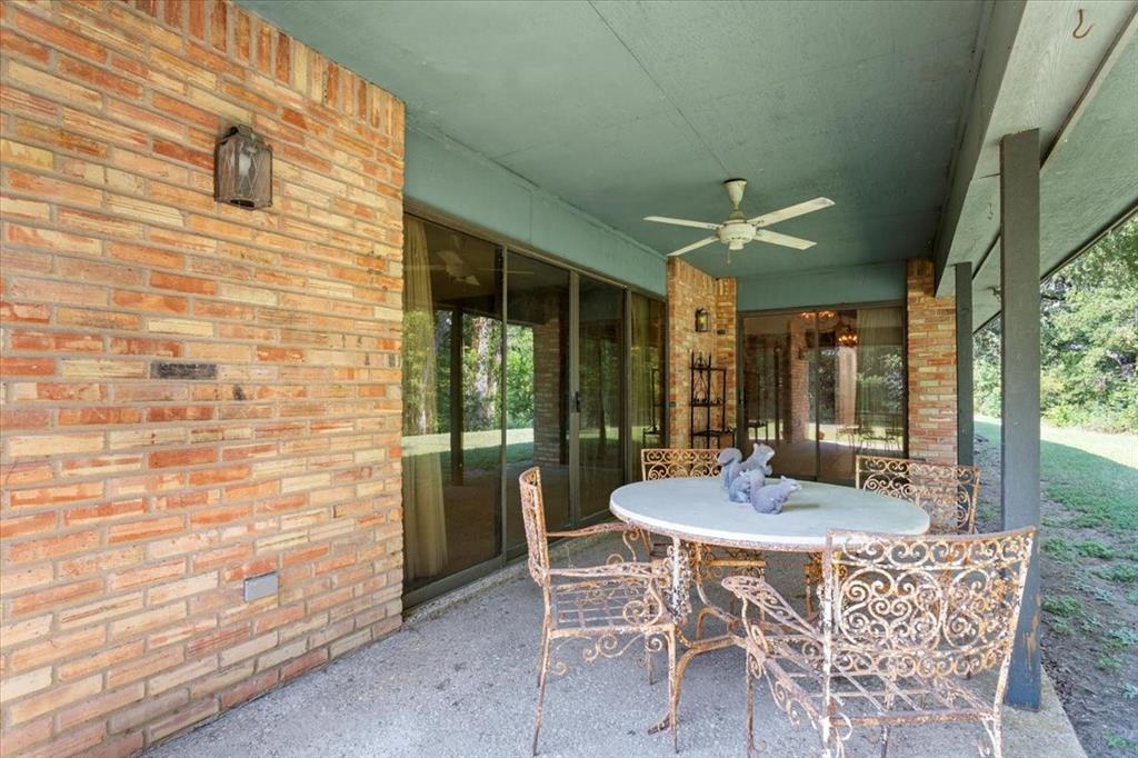 1487 Middleton Road Mart, TX 76664 - Photo 8 of 40 a view of an outdoor dining space with a table and chairs