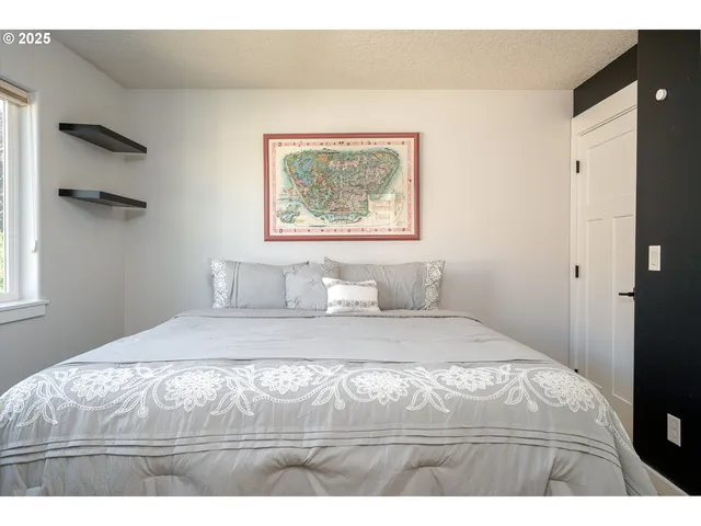 a view of bedroom with bed and window