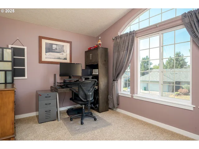 a workspace with furniture and a window