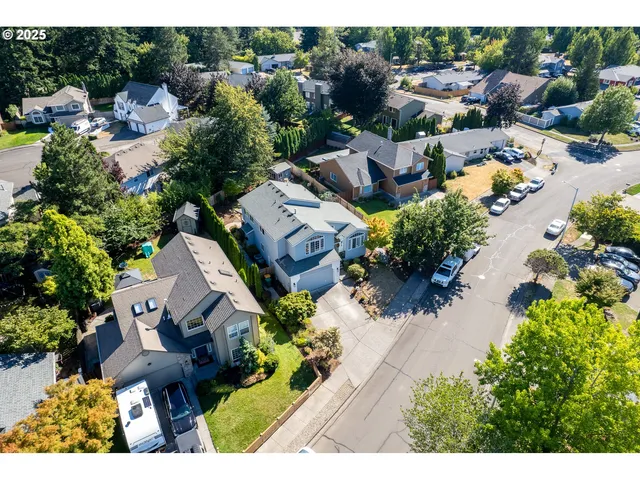 an aerial view of a house with lots of trees