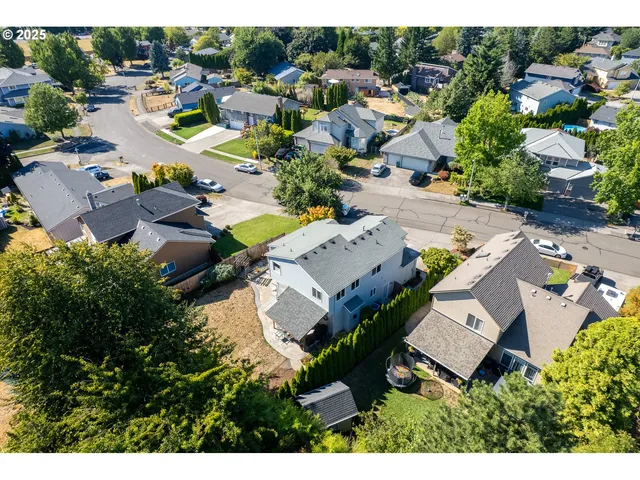 an aerial view of residential houses with outdoor space