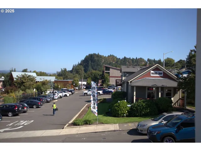 a view of multiple houses with a yard