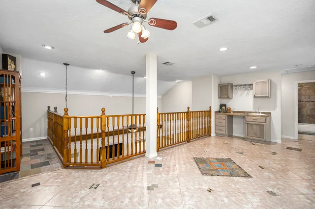 a view of a hallway with entryway to a livingroom