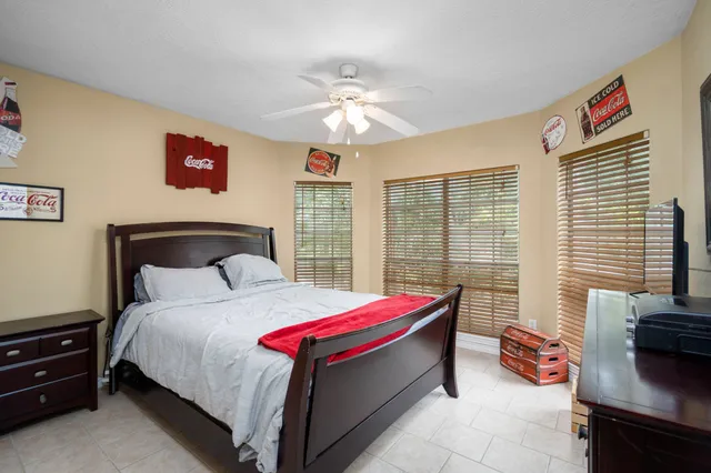 a view of a backyard with sitting area furniture and lake view