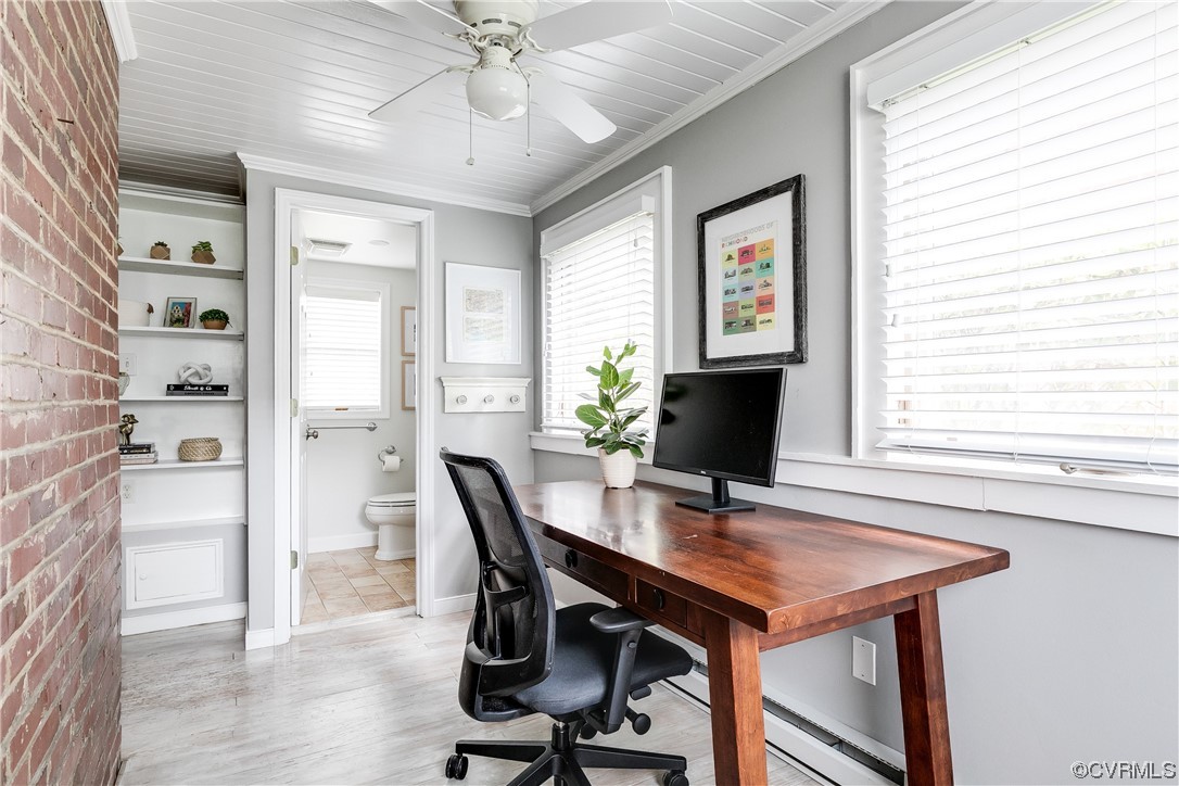 5115 Sylvan Road Richmond, VA 23225 - Photo 17 of 37 a view of a workspace with furniture and a window