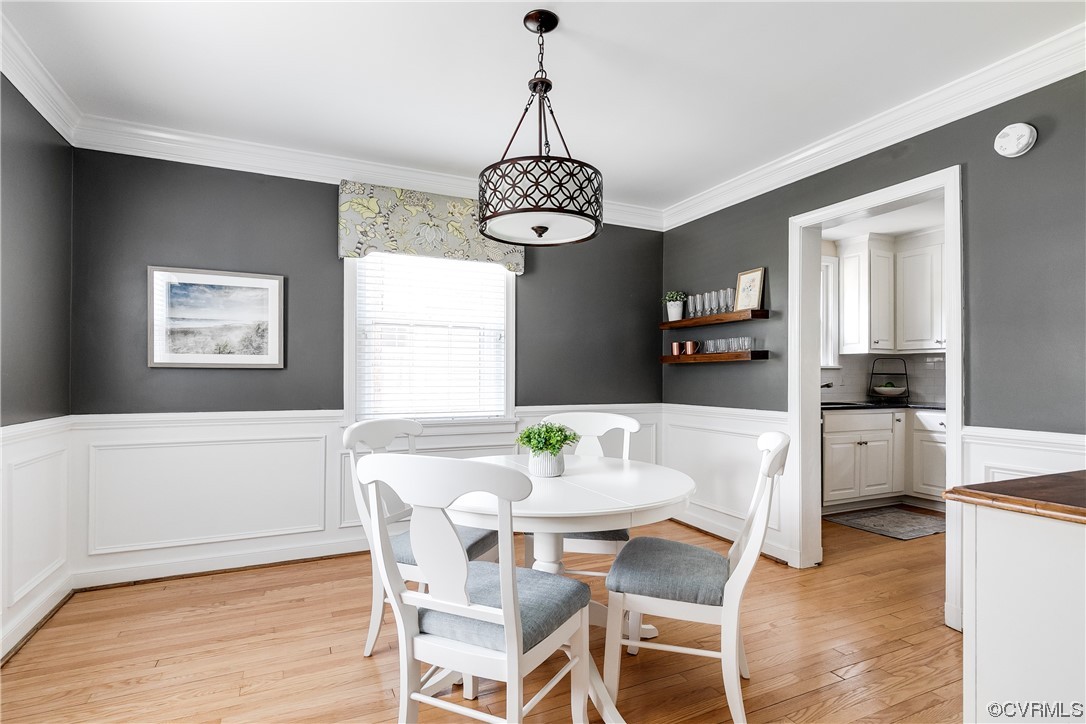 5115 Sylvan Road Richmond, VA 23225 - Photo 20 of 37 a view of a dining room with furniture window and wooden floor