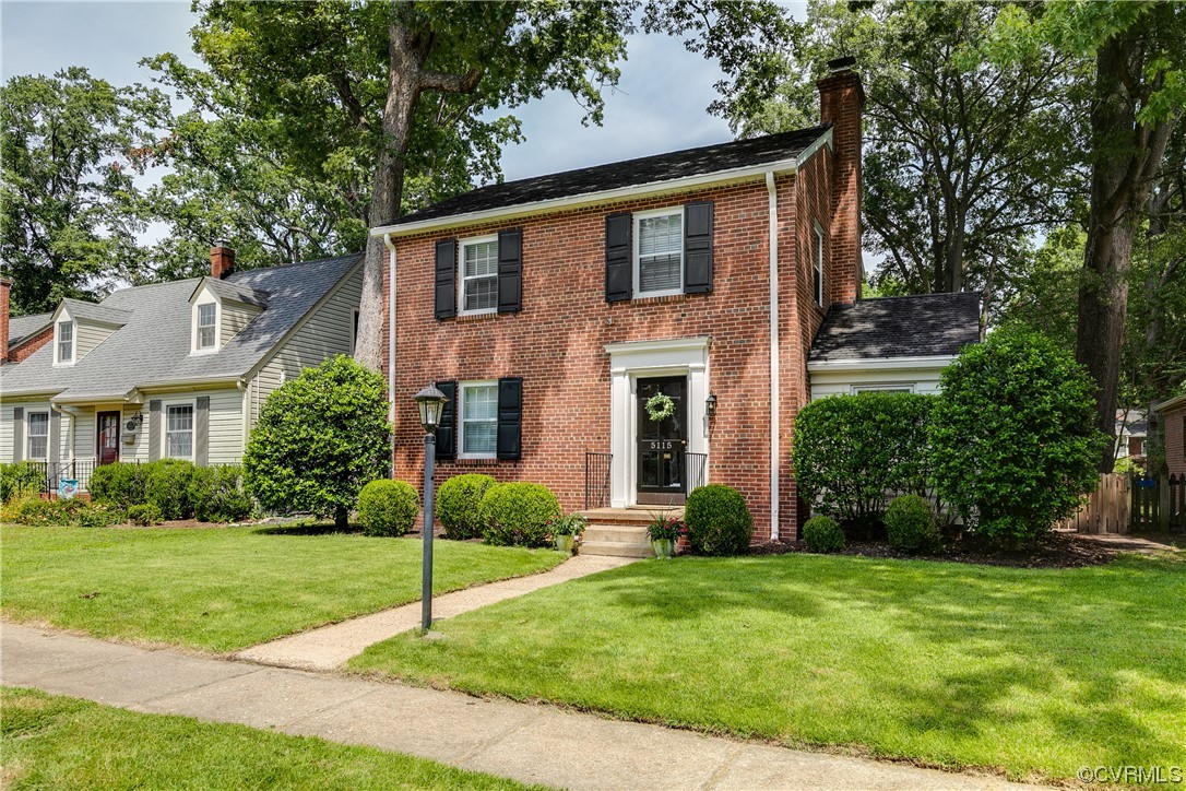 5115 Sylvan Road Richmond, VA 23225 - Photo 2 of 37 a front view of a house with a yard