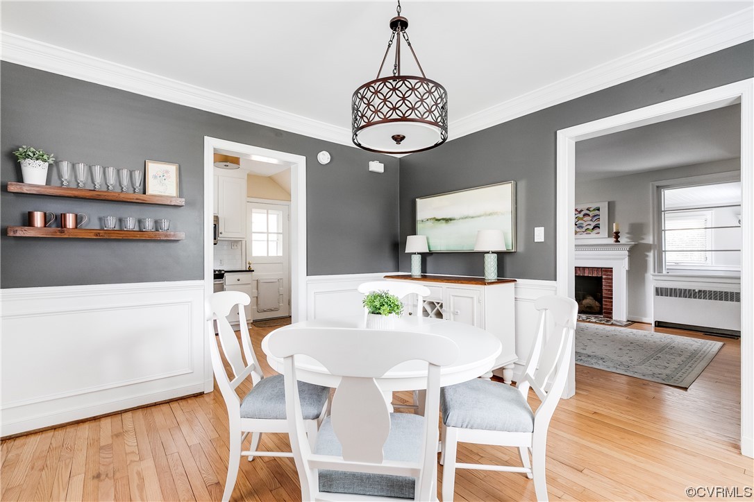 5115 Sylvan Road Richmond, VA 23225 - Photo 21 of 37 a view of a dining room with furniture wooden floor and a chandelier
