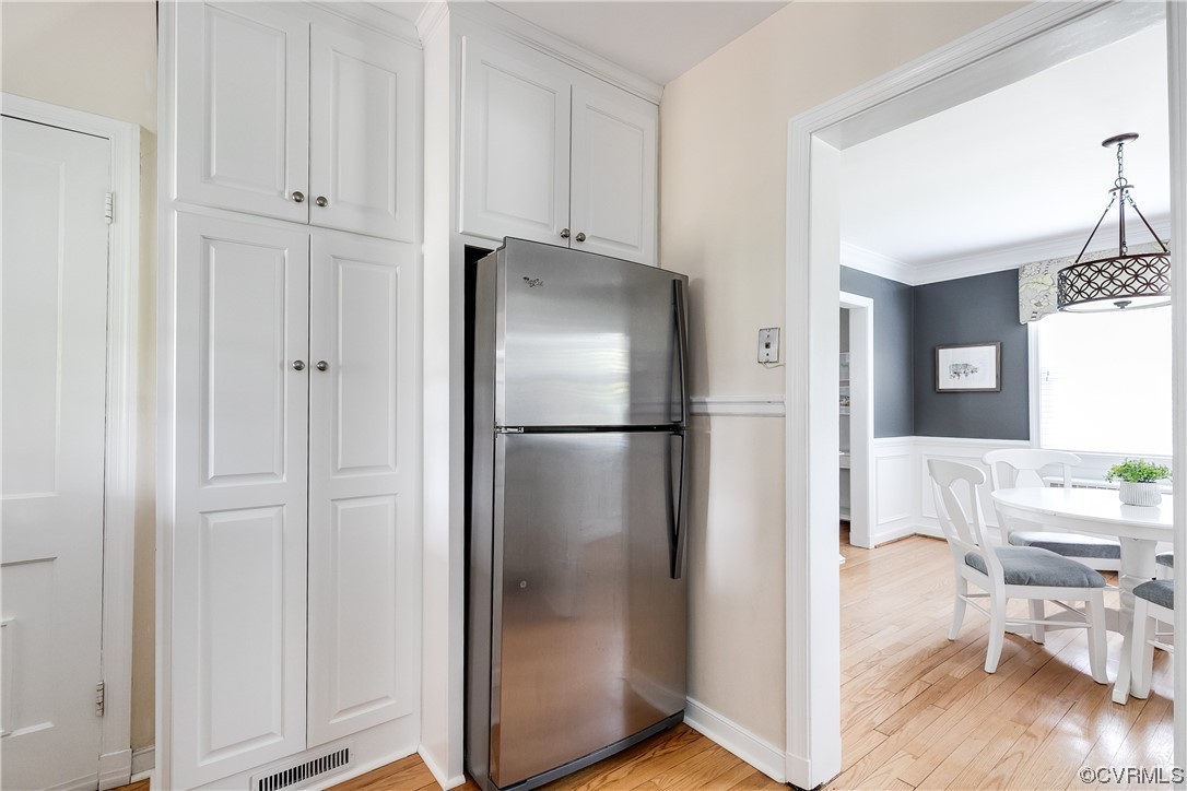 5115 Sylvan Road Richmond, VA 23225 - Photo 26 of 37 a kitchen with stainless steel appliances granite countertop a refrigerator and a view of living room