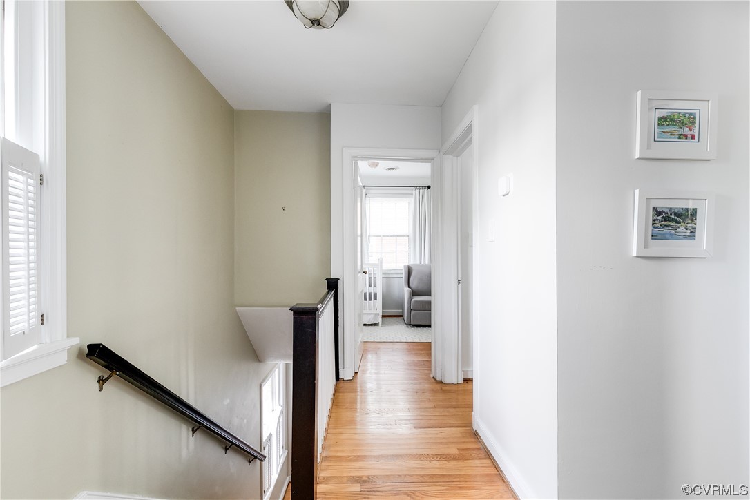 5115 Sylvan Road Richmond, VA 23225 - Photo 30 of 37 a view of a hallway with wooden floor and a living room