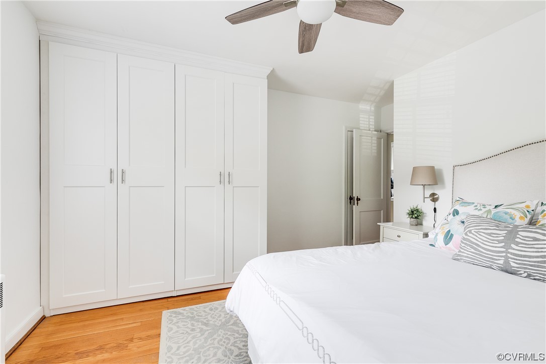 5115 Sylvan Road Richmond, VA 23225 - Photo 32 of 37 a bedroom with a bed and a chandelier