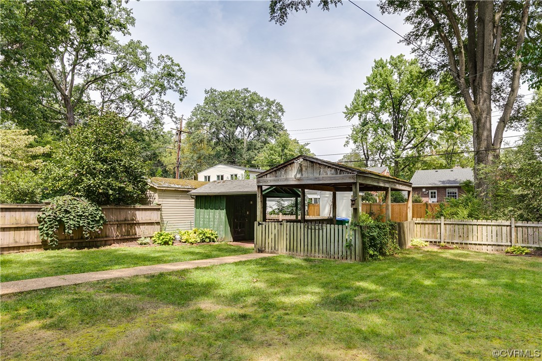 5115 Sylvan Road Richmond, VA 23225 - Photo 5 of 37 a front view of a house with a yard