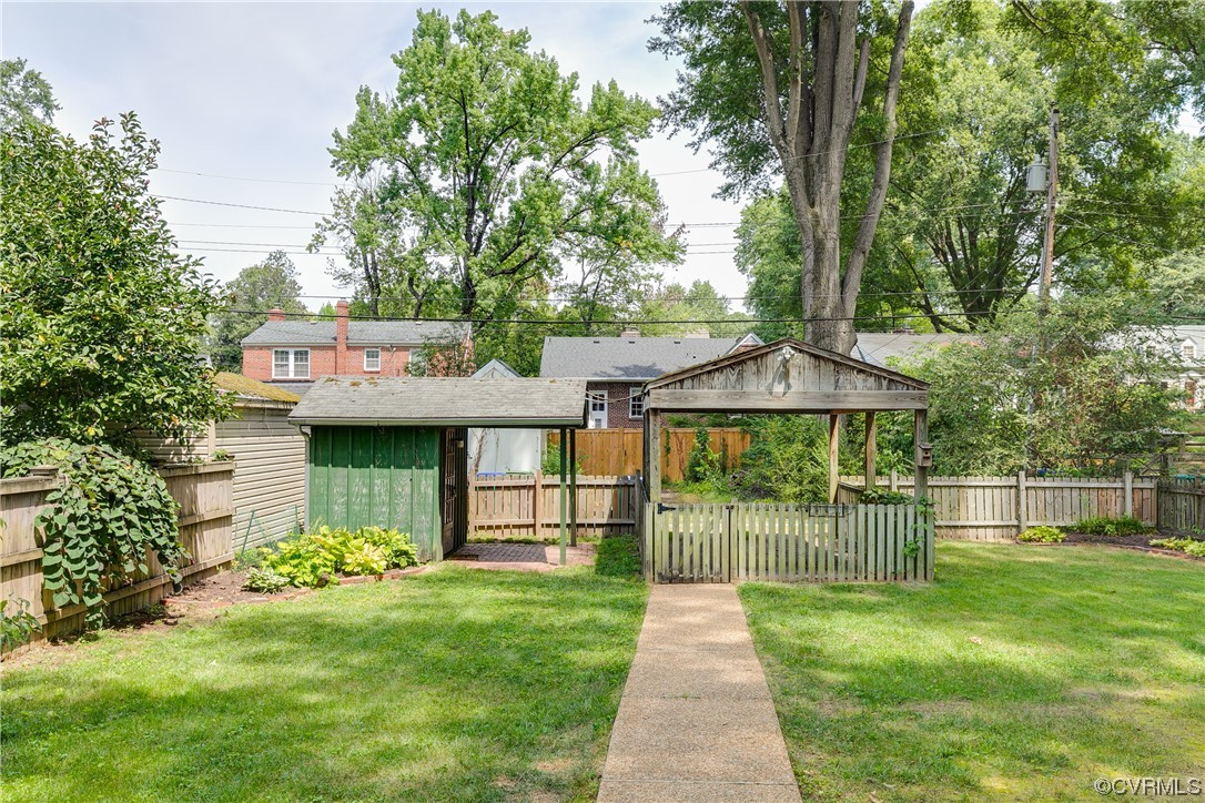 5115 Sylvan Road Richmond, VA 23225 - Photo 8 of 37 a front view of a house with a garden