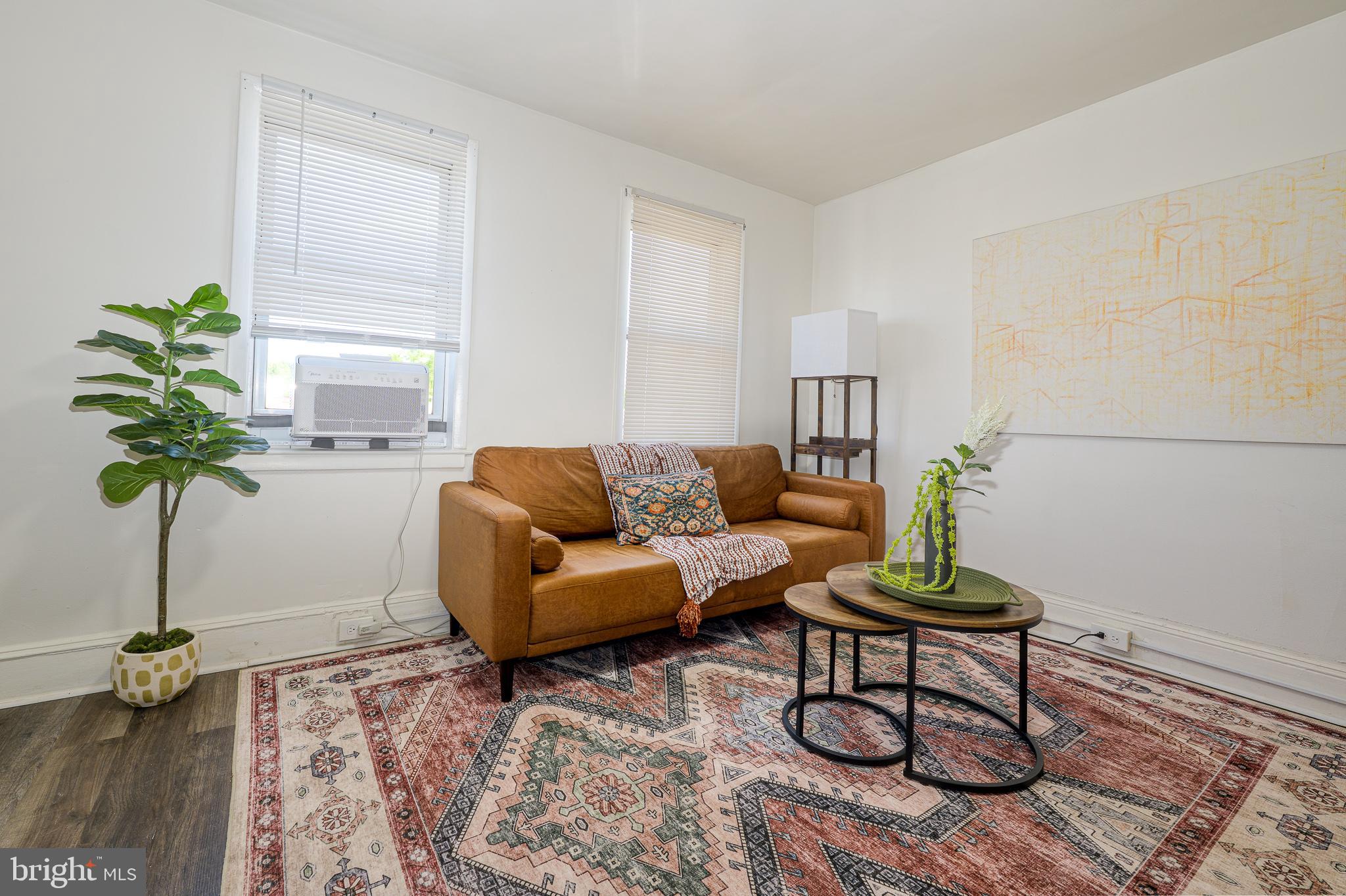 7104 Harford Road Baltimore, MD 21234 - Photo 8 of 37 a living room with furniture potted plant and a lamp