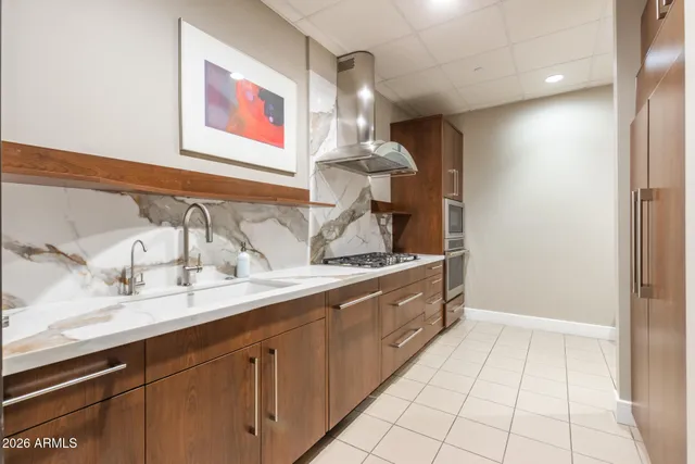 a spacious bathroom with a sink and a mirror