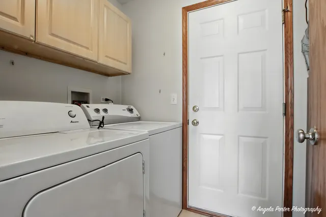 an empty room with a ceiling fan and a window