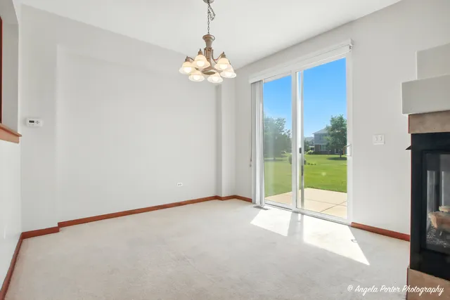 a view of an empty room with glass door