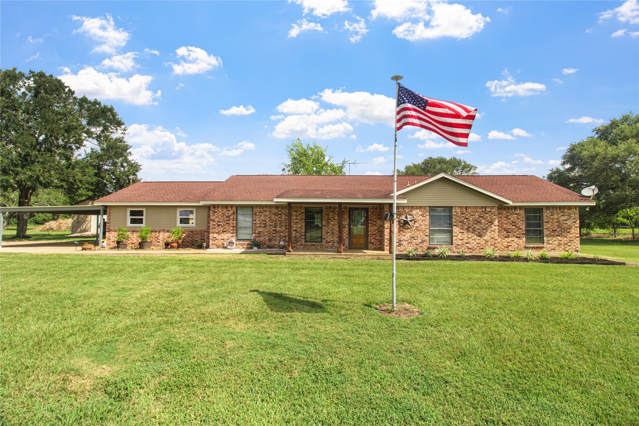 a front of a house with a garden