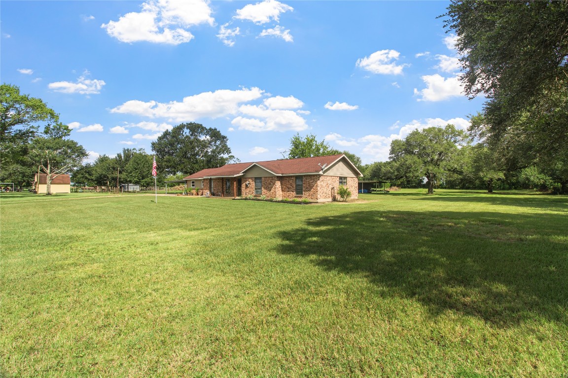10704 Buls Road East Bernard, TX 77435 - Photo 12 of 49 a view of a house with a big yard