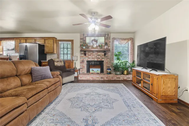 a living room with furniture rug and window