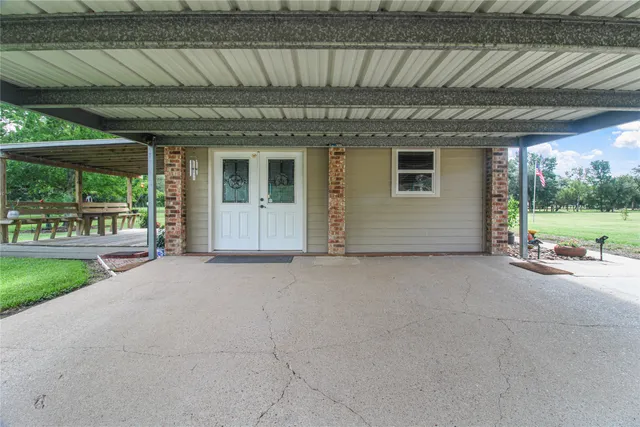 a view of a swimming pool with a patio
