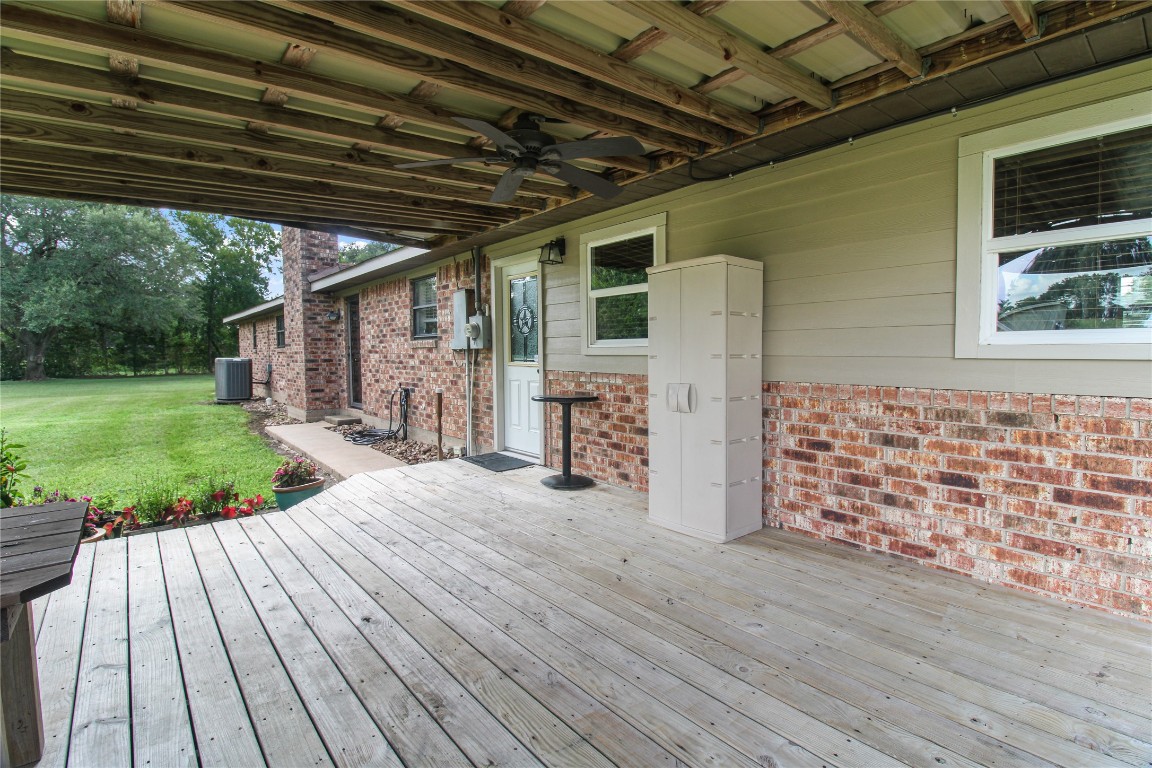 10704 Buls Road East Bernard, TX 77435 - Photo 9 of 49 a view of a porch with wooden floor