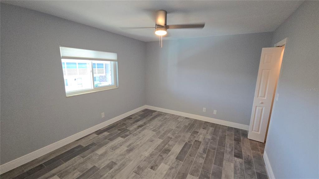 3755 South School Avenue, Unit 42 Sarasota, FL 34239 - Photo 11 of 22 an empty room with a window