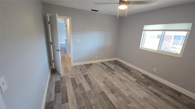 a view of staircase with white walls and a window
