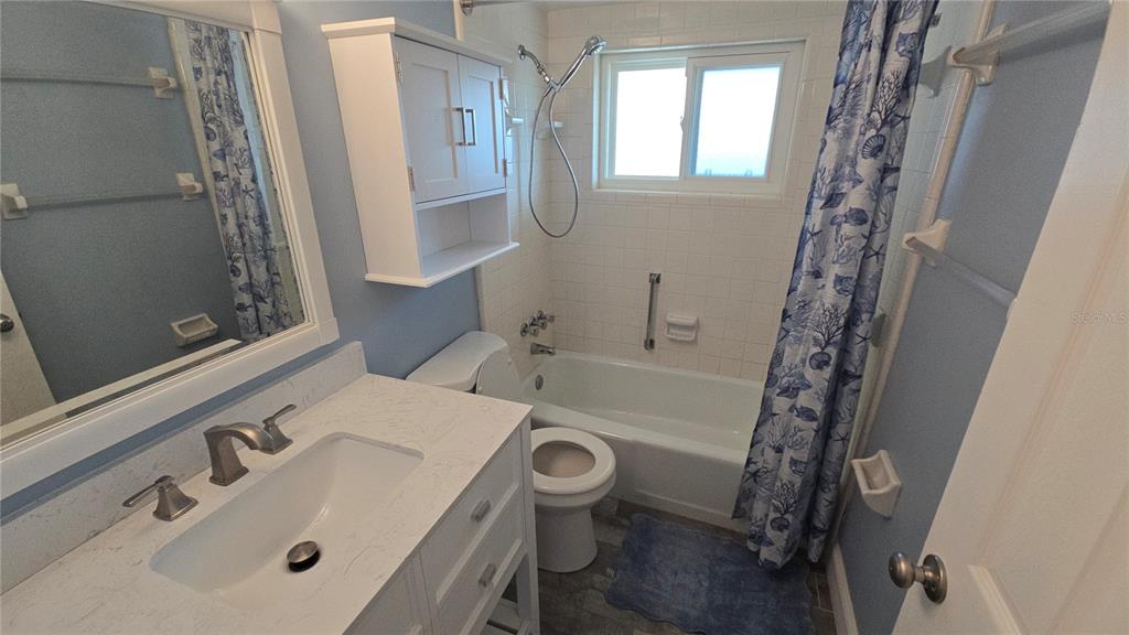 3755 South School Avenue, Unit 42 Sarasota, FL 34239 - Photo 17 of 22 a bathroom with a sink a toilet and shower