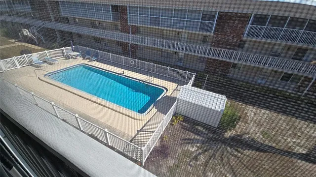 a view of swimming pool with outdoor seating