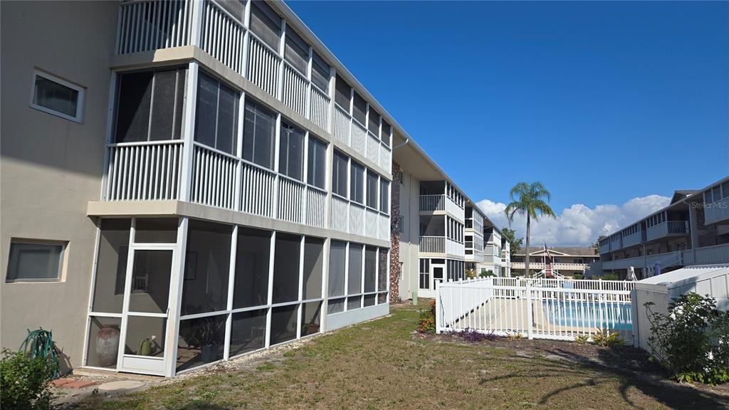 3755 South School Avenue, Unit 42 Sarasota, FL 34239 - Photo 2 of 22 a view of a building with a window