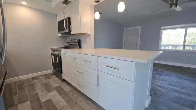 a view of a kitchen with a sink and dishwasher