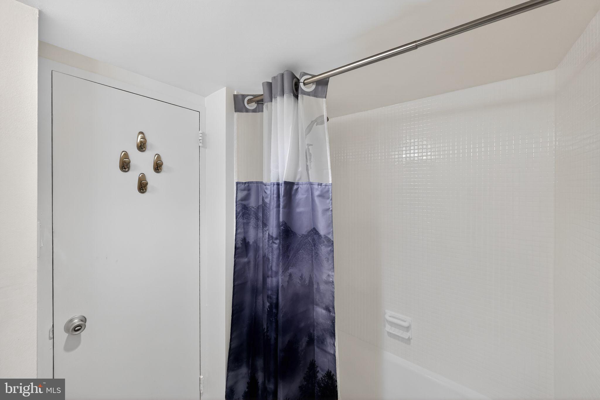 429 N Street Southwest, Unit S210 Washington, DC 20024 - Photo 5 of 16 a bathroom with a shower and a glass door