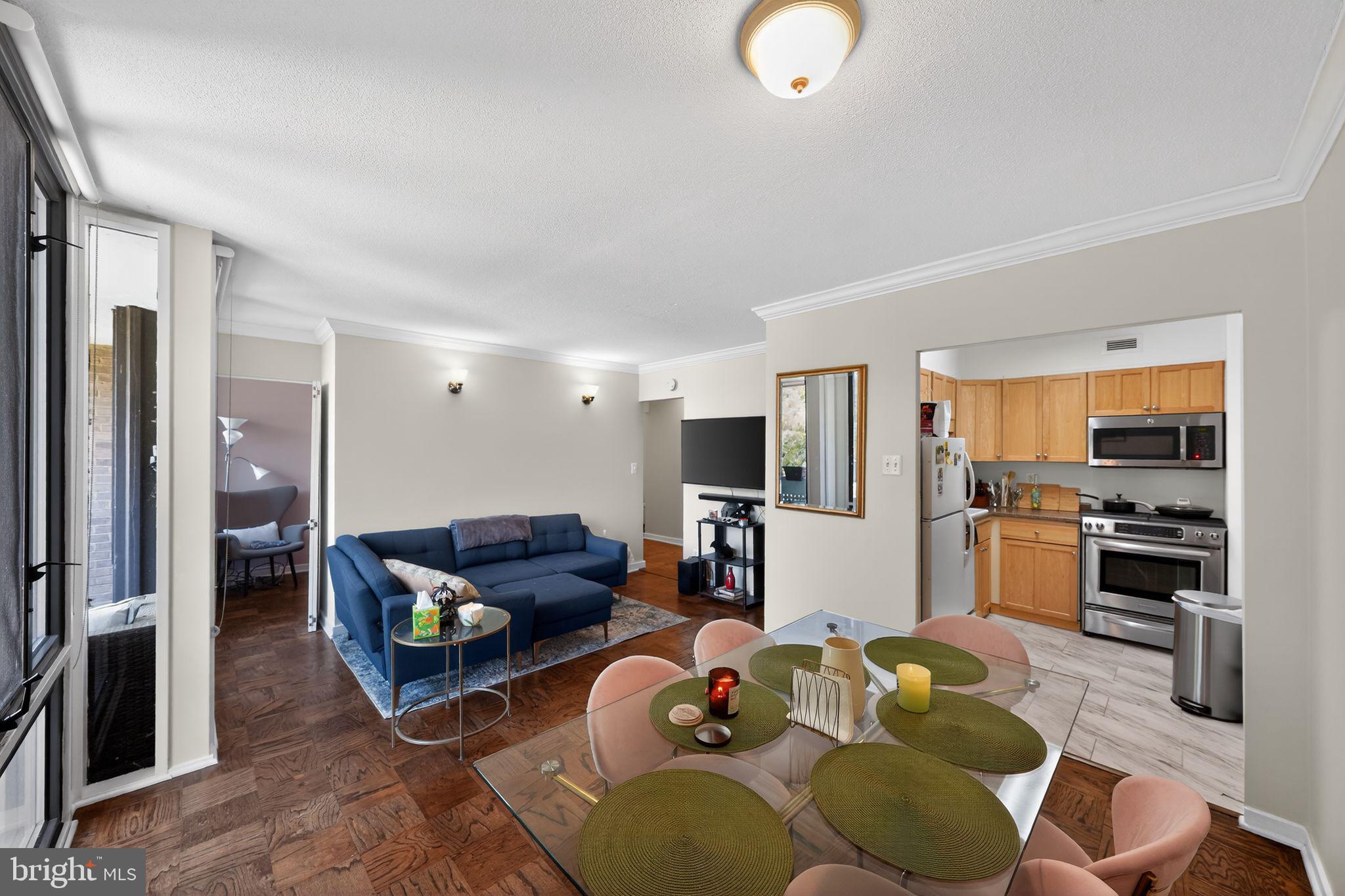 429 N Street Southwest, Unit S210 Washington, DC 20024 - Photo 8 of 16 a living room with furniture and a flat screen tv