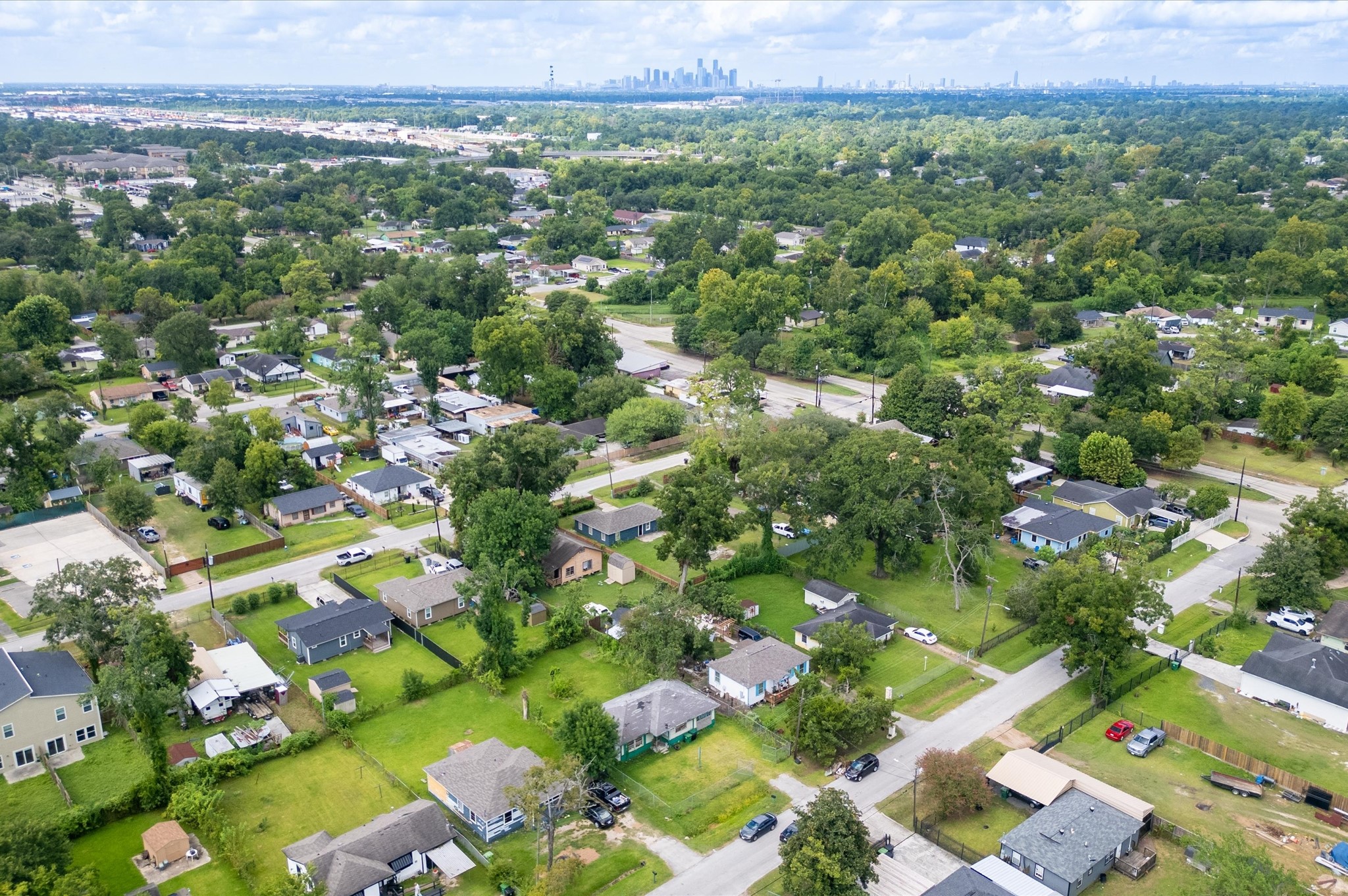 7926 Linda Vista Road Houston, TX 77028 - Photo 13 of 13 a view of a city with lush green forest