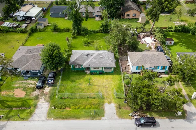 an aerial view of a house with a garden