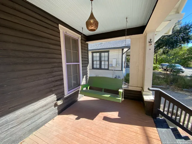 a view of backyard with a deck