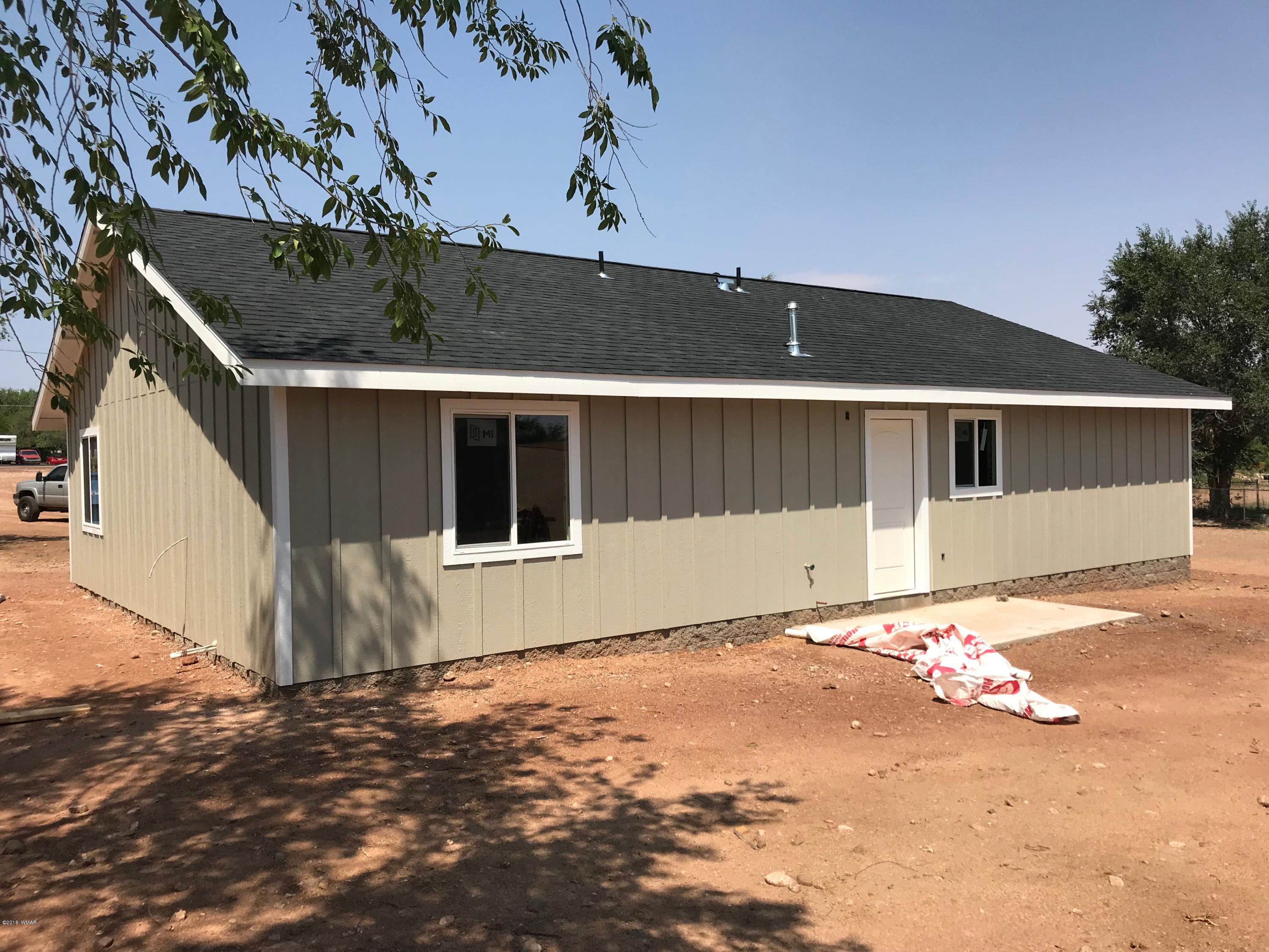 345 South 5th W Street Snowflake, AZ 85937 - Photo 3 of 11 a front view of a house with a yard