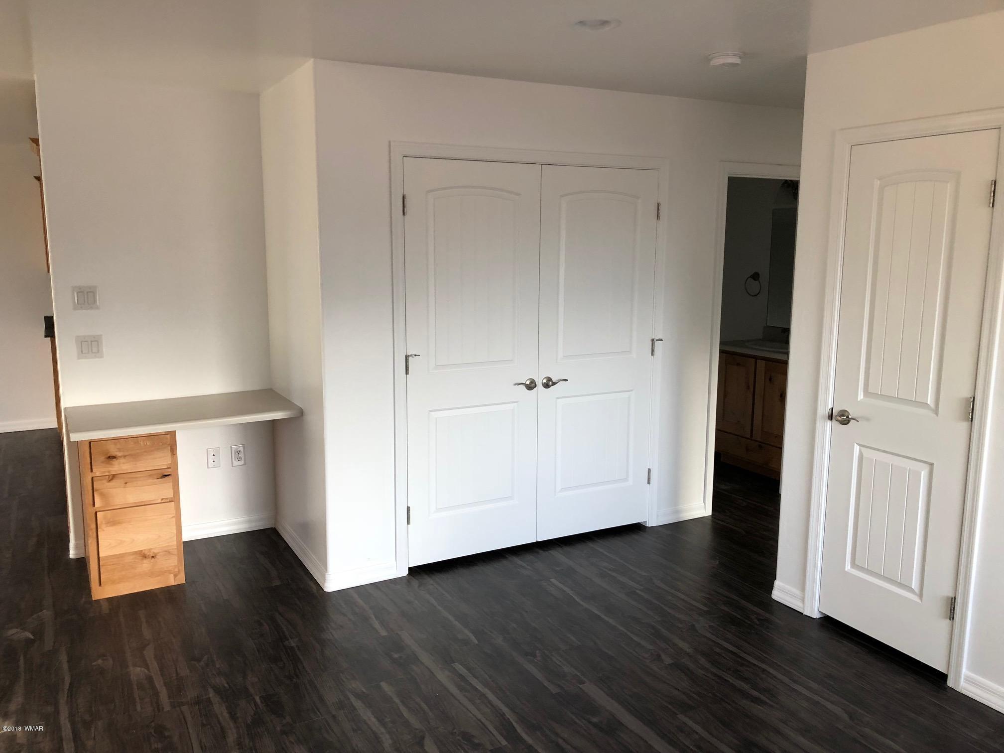 345 South 5th W Street Snowflake, AZ 85937 - Photo 6 of 11 a view of an empty room with wooden floor