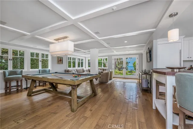 a kitchen with stainless steel appliances a sink stove and cabinets