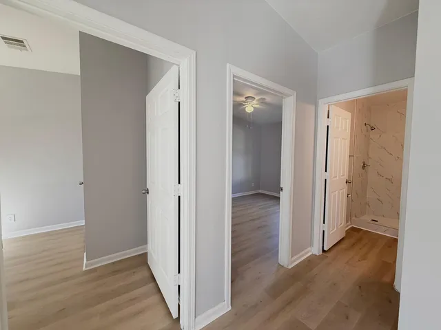 a white toilet sitting next to a bathroom sink